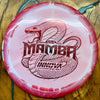 A pink and white disc golf driver featuring a red snake graphic and the text 'Mamba' and 'Innova Disc Golf'.
