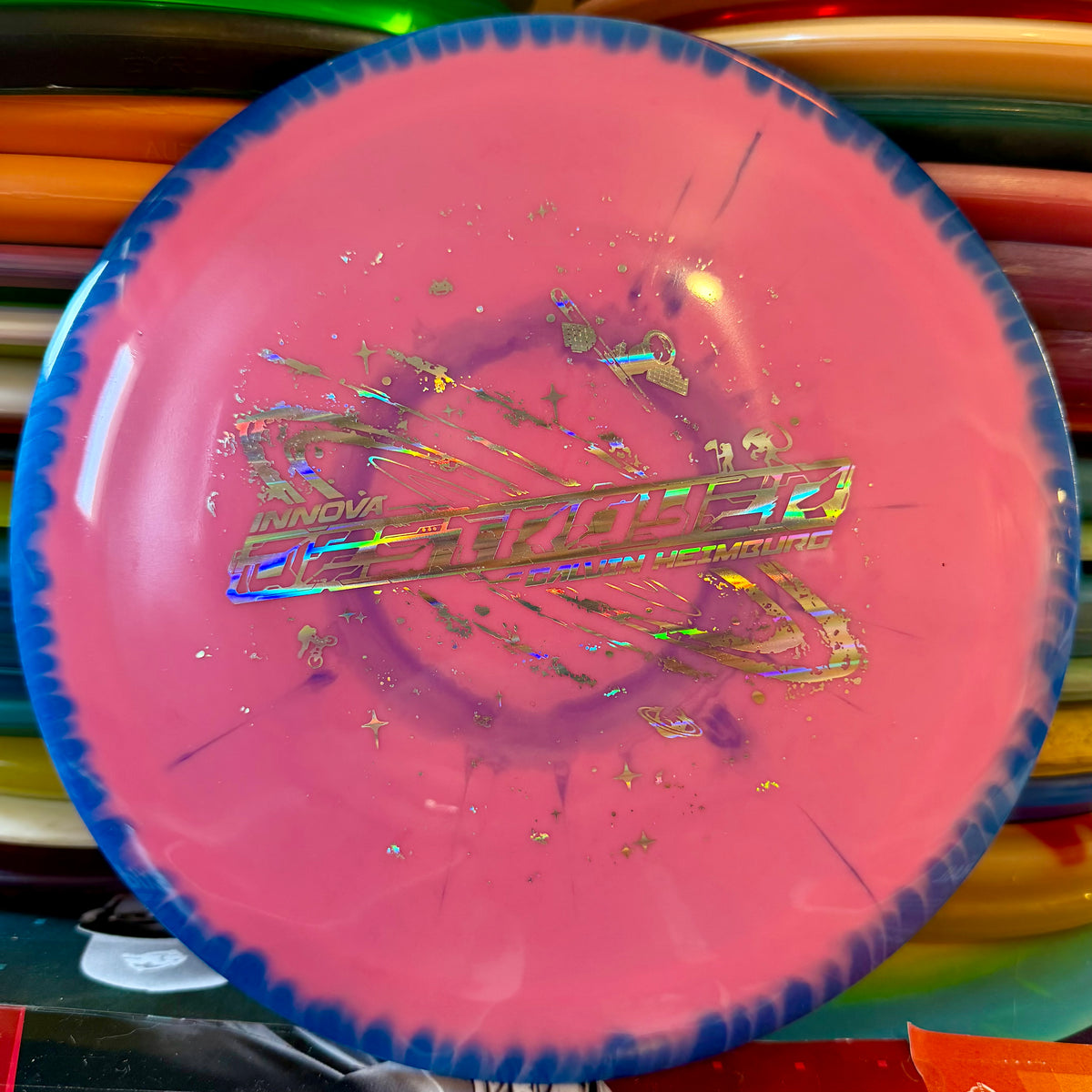 Innova Calvin Heimburg Halo Star Destroyer distance driver, pink with a blue rim and foil Destroyer stamp, top view
